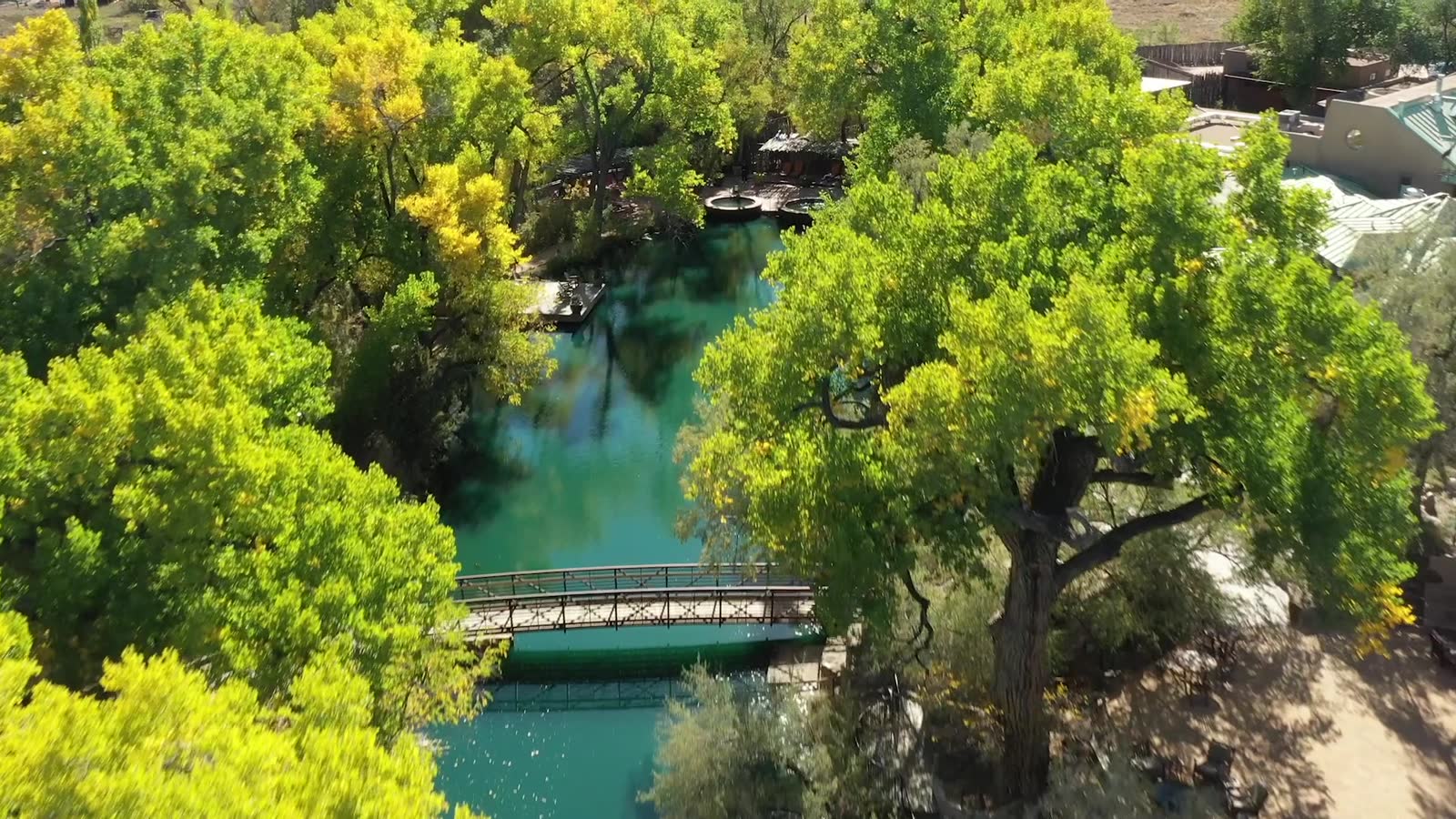 Aerial view of Ojo Santa Fe springs among cottonwoods